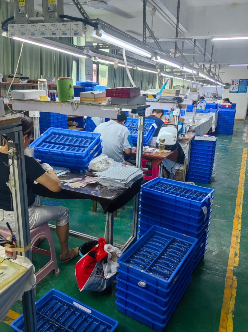 Assembly area for finished glasses made of gold, titanium, and acetate fiber materials